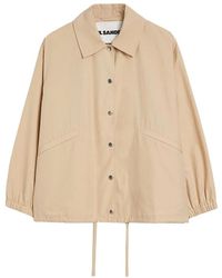 Jil Sander - Logo-print-wasserabweisende jacke mit kapuze - Lyst