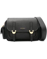 Coccinelle - Schwarze leder schultertasche mit gehämmerter textur - Lyst
