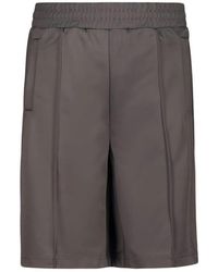 Palm Angels - Korte Broeken ,Grijs ,Polyester Back Curved Logo Track Shorts - Lyst
