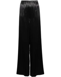 Ferragamo - Pantalones negros con acabado de satén y cintura alta - Lyst