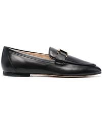 Tod's - Scarpe nere loafer stile elegante - Lyst