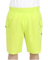 The North Face - Shorts sportivi gialli fluorescenti con tasca - Lyst