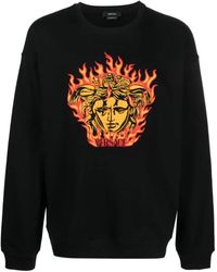 Versace - Schwarzer pullover mit medusa flame logo - Lyst