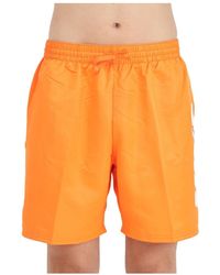 Nike - Shorts mare arancione big block - Lyst