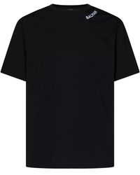 Balmain - Magliette nera in cotone organico con logo ricamato - Lyst