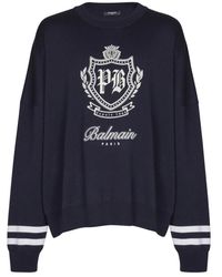 Balmain - Truien & Vesten ,Blauw ,Wol College Emblem Gebreide Trui - Lyst