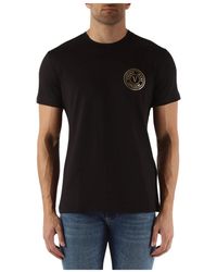 Versace - T-shirt slim fit in cotone con stampa logo - Lyst