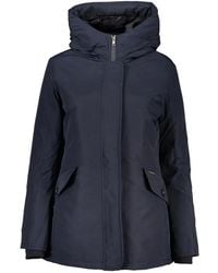 Woolrich - Giacca blu con cappuccio - Lyst