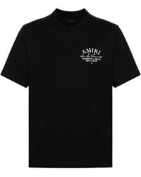 Amiri - Schwarzes t-shirt mit logo-print und rundhalsausschnitt - Lyst