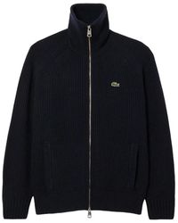 Lacoste - Truien & Vesten ,Blauw ,Wol Geborsteld Wollen Sweater Met Hoge Kraag En Rits - Lyst