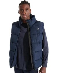 Superdry - Jassen ,Blauw ,Vintage Mouwloze Gewatteerde Jas - Lyst