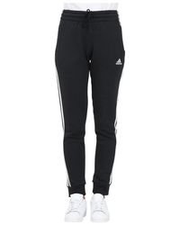 adidas - Essentials 3-stripes fleece pantaloni sportivi neri per donne - Lyst