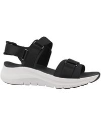 Skechers - Schoenen ,Zwart ,Stijlvolle Platte Sandalen Voor Vrouwen - Lyst