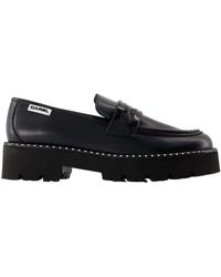 CAREL PARIS - Schwarze Lederschuhe Mit Flacher Sohle Und Messingdetails - Lyst