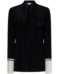 Victoria Beckham - Camisa de seda negra con puños plisados - Lyst