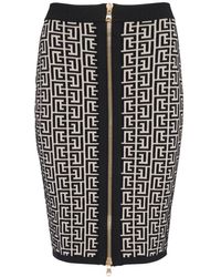 Balmain - Halblanger Strickrock Monogramm - Lyst