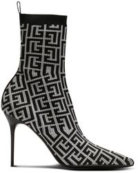 Balmain - Skye stretch knit ankle boots with monogram - Lyst