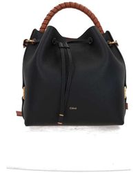 Chloé - Schwarze gehämmerte leder bucket tasche mit braunen details - Lyst