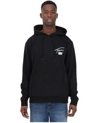 Tommy Hilfiger - Schwarzer hoodie mit metallischem logo - Lyst