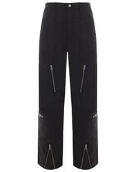 Stussy - Pantaloni neri larghi con ricamo logo e zip - Lyst