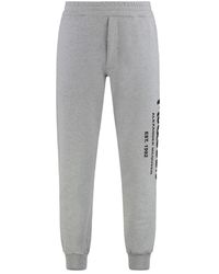 McQueen - Broeken ,Grijs ,Katoen Grijze Melange Maxi Logo Trainingsbroeken - Lyst