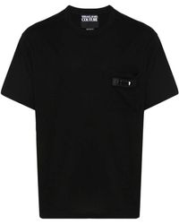 Versace - T-shirt e polo nere con logo appliqué - Lyst