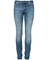 Guess - Ausgeblichene skinny jeans mit goldener naht - Lyst