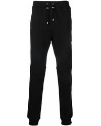 Balmain - Schwarze baumwoll-sweatpants mit logo-print - Lyst