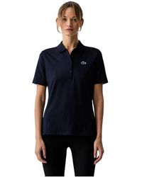 Lacoste - Tops ,Blauw ,Polyester Slim Fit Uv Protect Stretch Golf Polo - Lyst