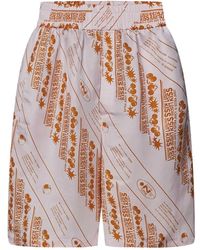 Jil Sander - Shorts oversize rosa con stampa a contrasto - Lyst