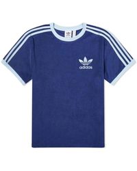 adidas Originals - T-shirt in terry blu scuro con strisce laterali - Lyst