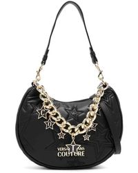 Versace - Schwarze hobo-tasche mit logo-sternen und goldener kette - Lyst