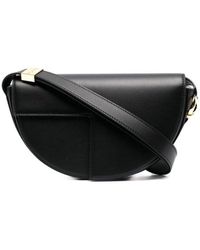 Patou - Schwarze leder-schultertasche mit aussparungen - Lyst