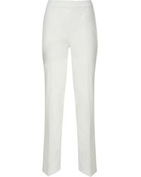 Genny - Slim-fit trousers - Lyst
