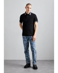 Versace - Monogramm schwarzes polo-shirt - Lyst