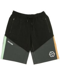 DOLLY NOIRE - Stretch-badeshorts in future - Lyst