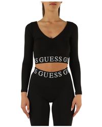 Guess - Active: top manica lunga in tessuto stretch - Lyst