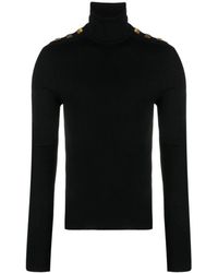 Balmain - Maglioni in lana neri con collo alto e bottoni sulle spalle - Lyst