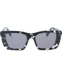 Prada - Ikonoische sonnenbrille mit polarisierten gläsern - Lyst