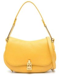 Coccinelle - Gelbe Lederhandtasche Mit Drehverschluss - Lyst