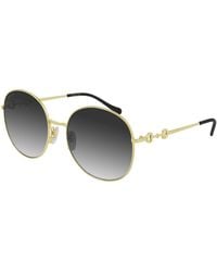 Gucci - Gold/grey shaded sunglasses - Lyst