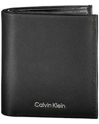 Calvin Klein - Accessoires ,Zwart ,Leer Stijlvolle Leren Bi-Fold Portemonnee Met Rfid-Blokkering - Lyst