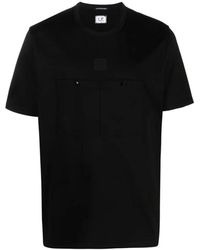 C.P. Company - Schwarzes jersey t-shirt mit logo-print und vordertaschen - Lyst