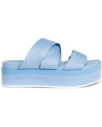 Calvin Klein - Sandalia piatta blu con cinghie in tessuto - Lyst