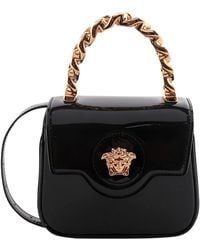 Versace - Schwarze lederhandtasche mit kettenhenkel - Lyst