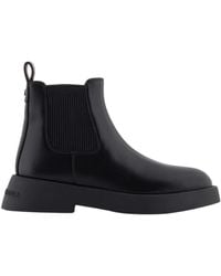 ARMANI EXCHANGE - Schwarze Leder-Logo-Stiefel Runde Zehe - Lyst