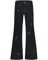 flâneur - Bestickte Relikte Raw Denim Flared Jeans - Lyst