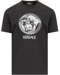 Versace - Magliette nera con collo a giro e logo medusa ricamato - Lyst