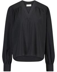 Jane Lushka - Blusa negra de jersey sofisticada con estampado juguetón - Lyst