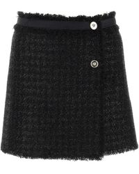 Versace - Minifalda de mezcla de lana negra - Lyst